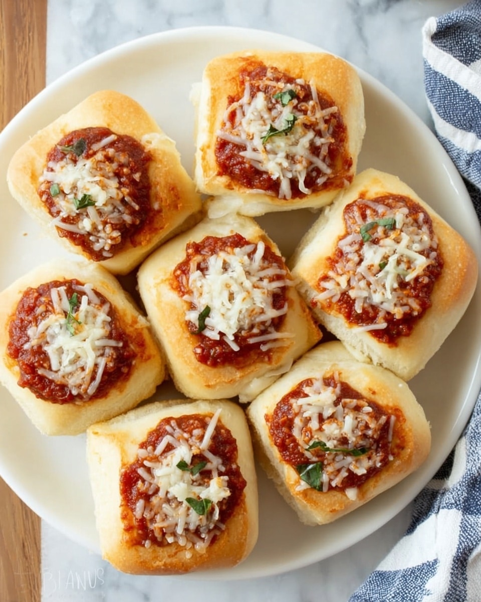 A white plate holds seven fluffy bread rolls, each topped with a swirl of red tomato sauce and sprinkled with shredded white cheese. The bread rolls are golden brown at the edges and soft in the middle, slightly square-shaped with rounded corners. The tomato sauce sits in the center of each roll, thick and rich with some green herbs mixed in. The cheese is scattered unevenly, melting slightly but still visible as distinct strands. The plate is placed on a white marbled surface, with part of a blue and white striped cloth napkin visible at the right edge. Photo taken with an iphone --ar 4:5 --v 7