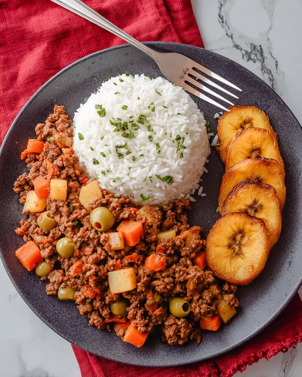 A dark gray round plate holds three clear parts of food on a white marbled surface. On the left side, there is a thick layer of cooked ground beef mixed with small orange carrot cubes, light yellow potato cubes, and round green olives, showing a mix of orange, brown, yellow, and green colors with a soft texture. Above this, on the top half right, there is a clean mound of fluffy white rice sprinkled lightly with small green herbs, giving a fresh look. On the bottom right, there are three slices of fried plantains, golden brown with a caramelized shiny surface, arranged neatly in a row. A silver fork rests above the plate on the white marbled surface, with a red cloth nearby adding a pop of color. Photo taken with an iphone --ar 4:5 --v 7