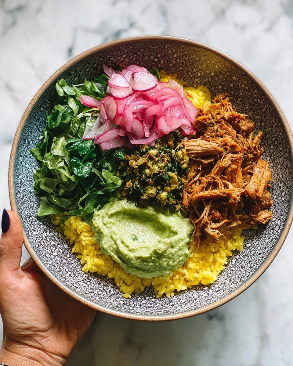 A blue patterned bowl holds a colorful layered dish starting at the bottom with a layer of yellow rice, topped on one side by shredded orange-brown chicken, and next to it a mound of bright green pesto sauce with visible texture. Adjacent is a dollop of chunky light green guacamole, all resting on a base of fresh dark green arugula leaves mixed with thin slices of cream and purple radishes. Thin pinkish-red onion slices sit near the chicken, adding a touch of light color. A woman's hand with brown nail polish holds the bowl from the lower left corner. The bowl is held over a white marbled textured surface. photo taken with an iphone --ar 4:5 --v 7